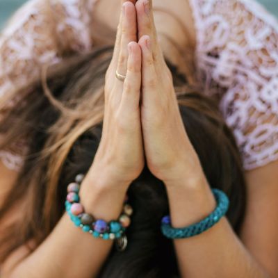 close-up-young-woman-with-hands-clasped