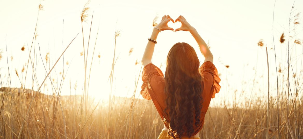 Stylish woman spending time in a summer field