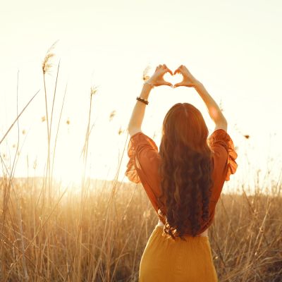 Stylish woman spending time in a summer field