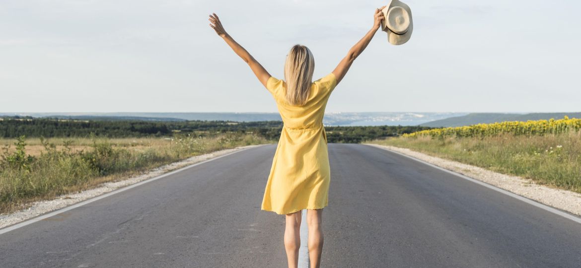 back-view-blonde-girl-running-middle-street