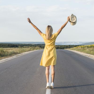 back-view-blonde-girl-running-middle-street