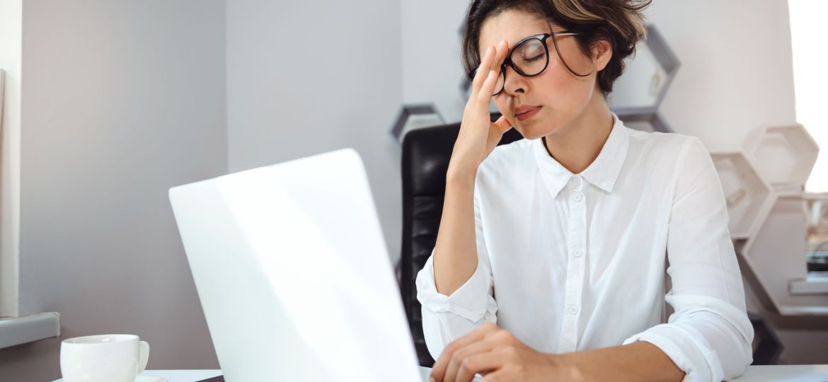 Young beautiful businesswoman working with laptop at workplace in office.