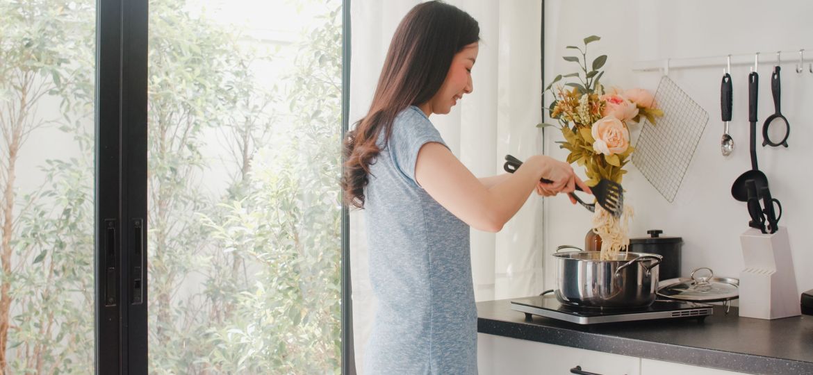 Young Asian Japanese lady enjoy cooking at home. Lifestyle women