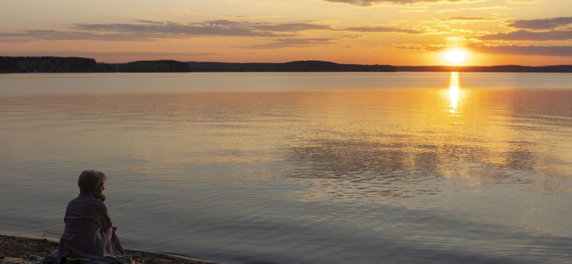 sad-contemplative-person-near-lake