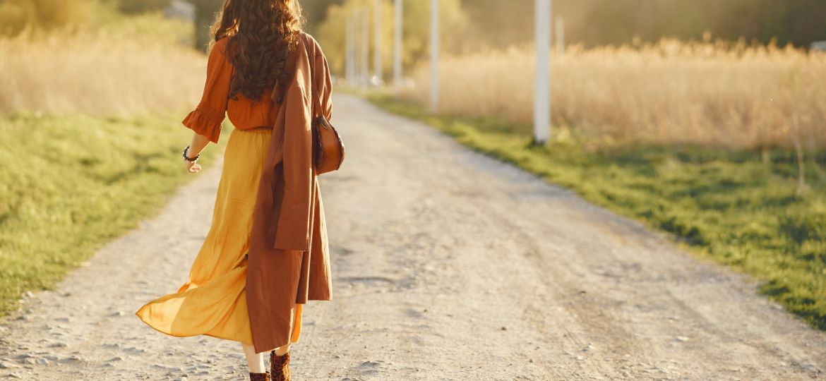 Stylish woman spending time in a summer field