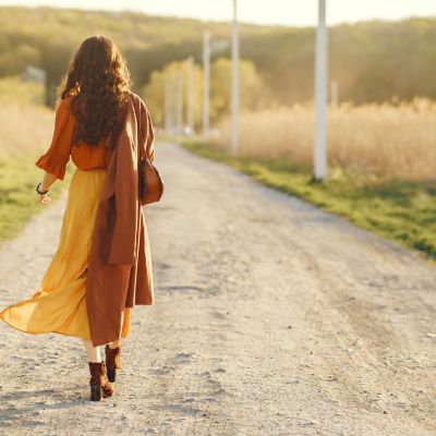 Stylish woman spending time in a summer field
